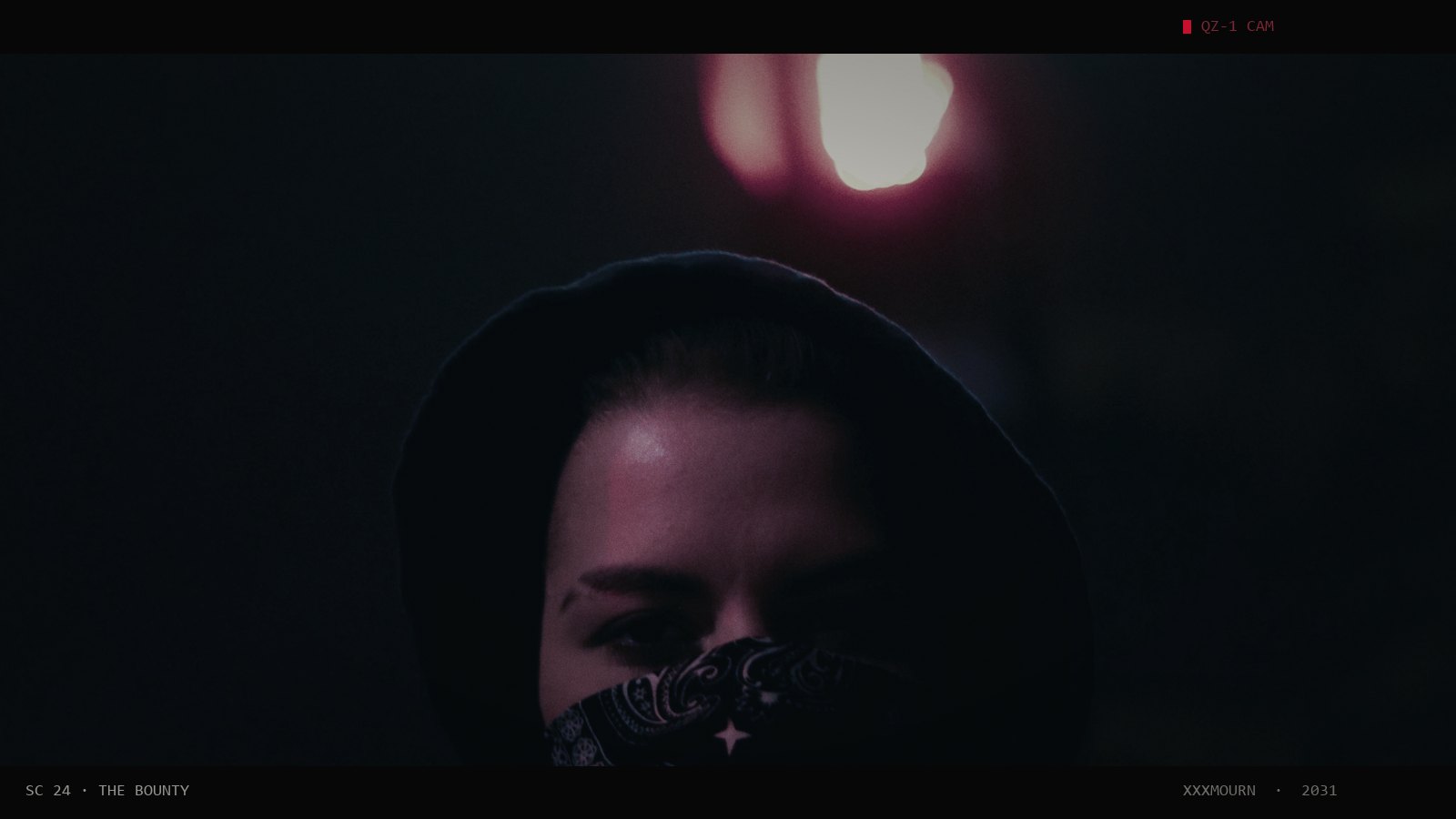 Hooded man with a mask over his face under red and teal light